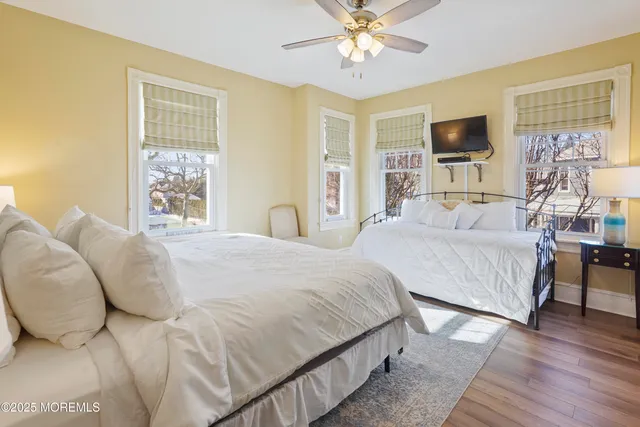 a bathroom with a sink mirror and vanity