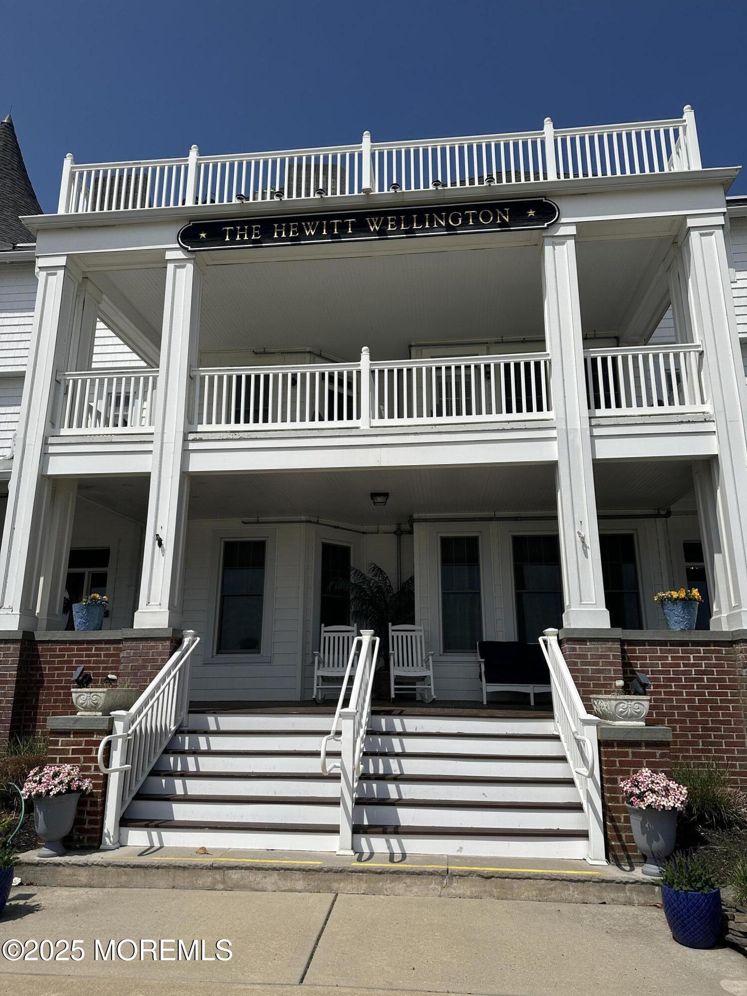 200 Monmouth Avenue, Unit 21 Spring Lake, NJ 07762 - Photo 5 of 37 a view of a house with a balcony