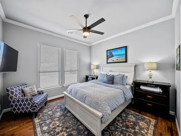 a bedroom with a bed and a couch