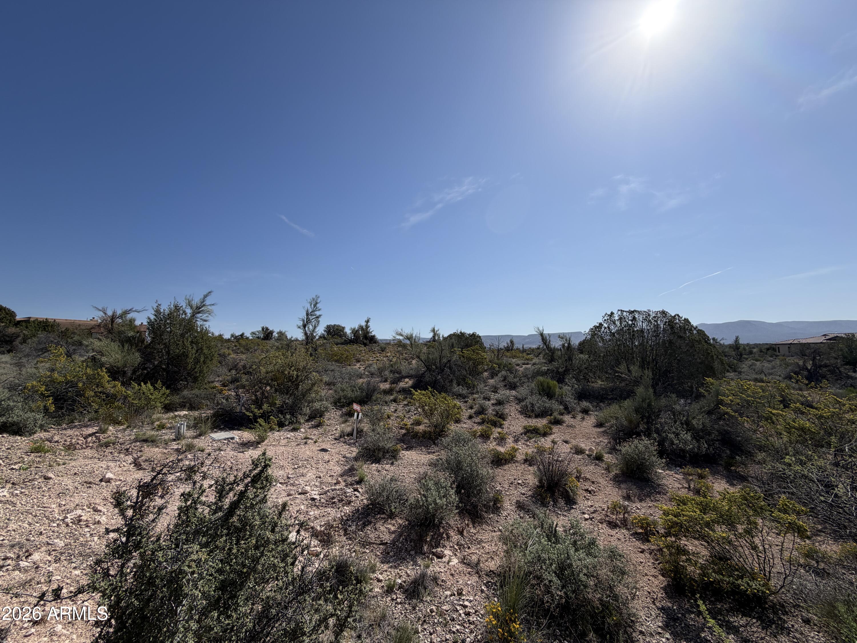 4850 Crazy Horse Circle, Unit 76 Rimrock, AZ 86335 - Photo 6 of 8 a view of a covered with trees in the background