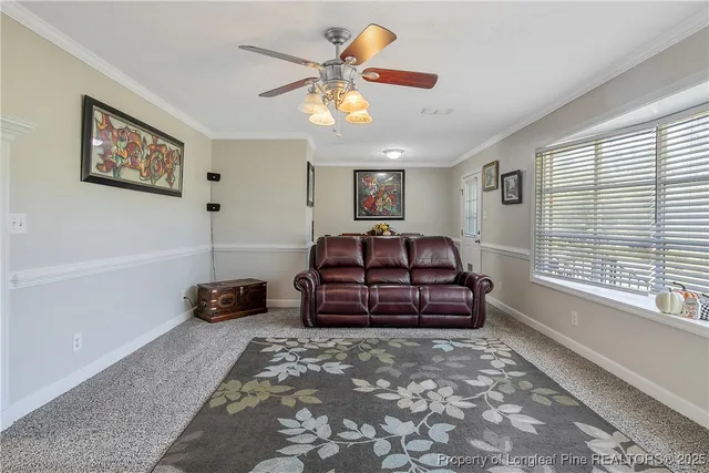 a living room with a flat screen tv and a large window