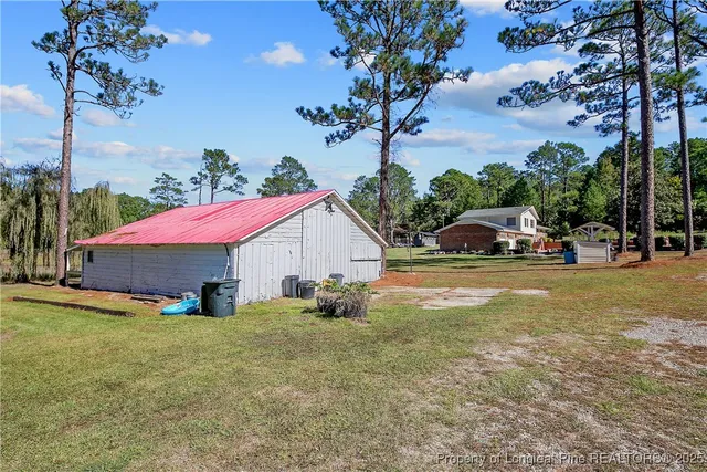 a view of a tree with a yard