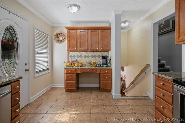 a view of kitchen with stainless steel appliances cabinets and a counter top space