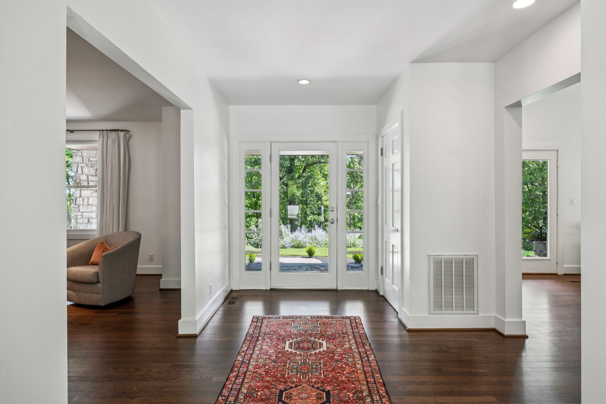 915 Overton Lea Road Nashville, TN 37220 - Photo 11 of 75 a view of an empty room with wooden floor and a window