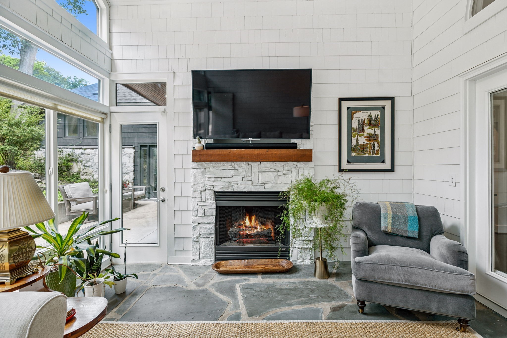 915 Overton Lea Road Nashville, TN 37220 - Photo 18 of 75 a living room with furniture a flat screen tv and a fireplace