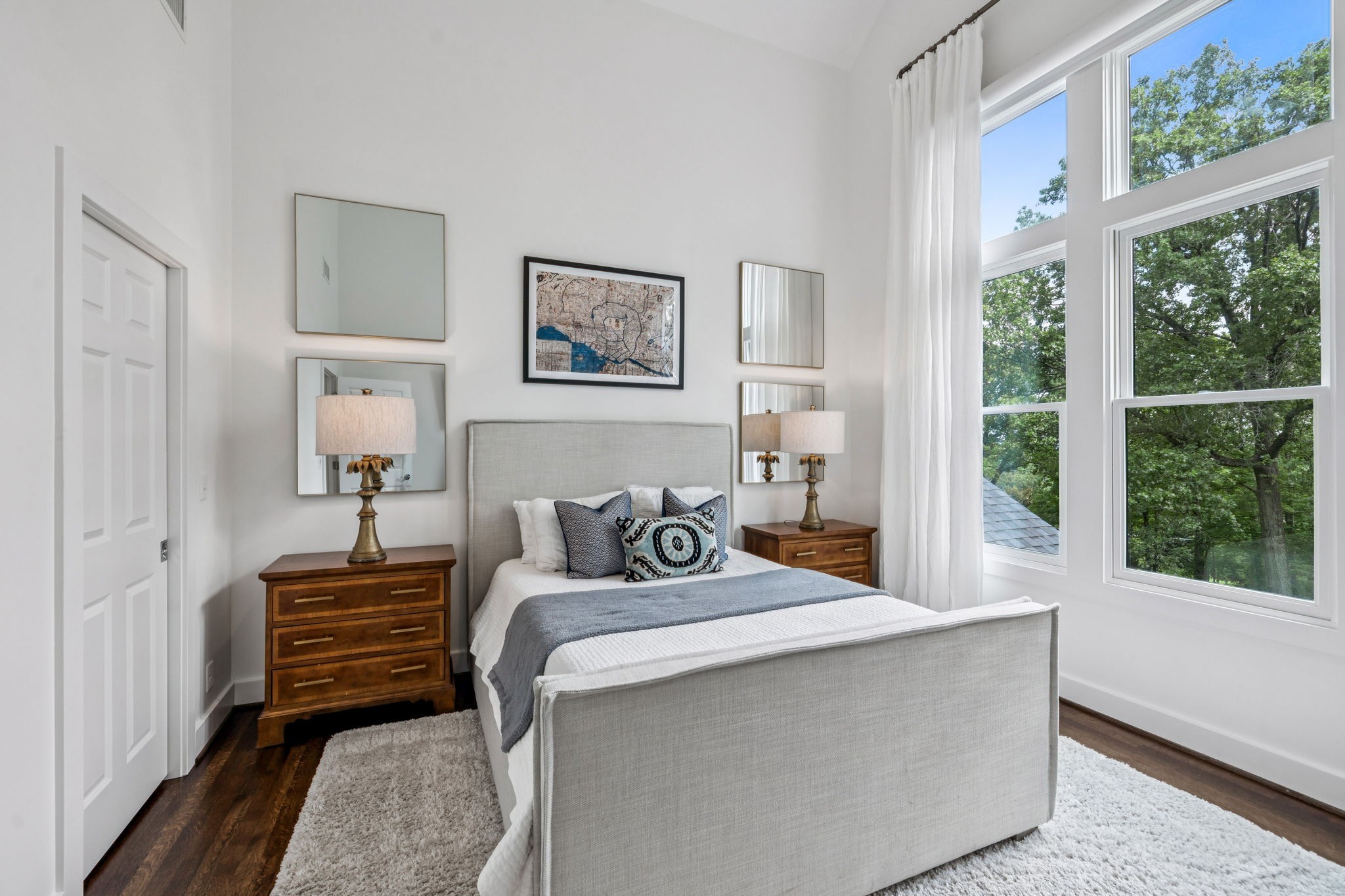 915 Overton Lea Road Nashville, TN 37220 - Photo 41 of 75 a bedroom with a bed and a large window
