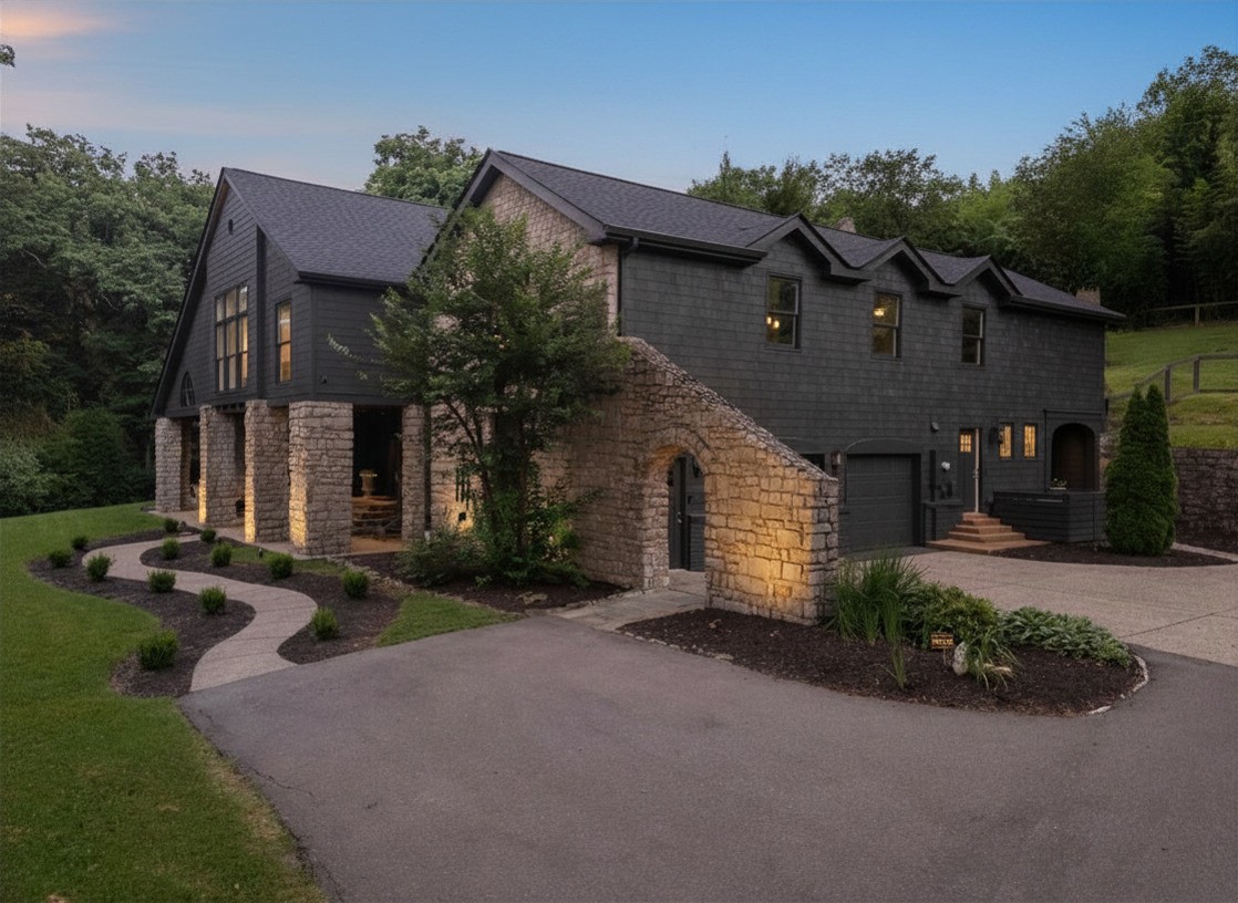 915 Overton Lea Road Nashville, TN 37220 - Photo 73 of 75 a front view of a house with garden and parking