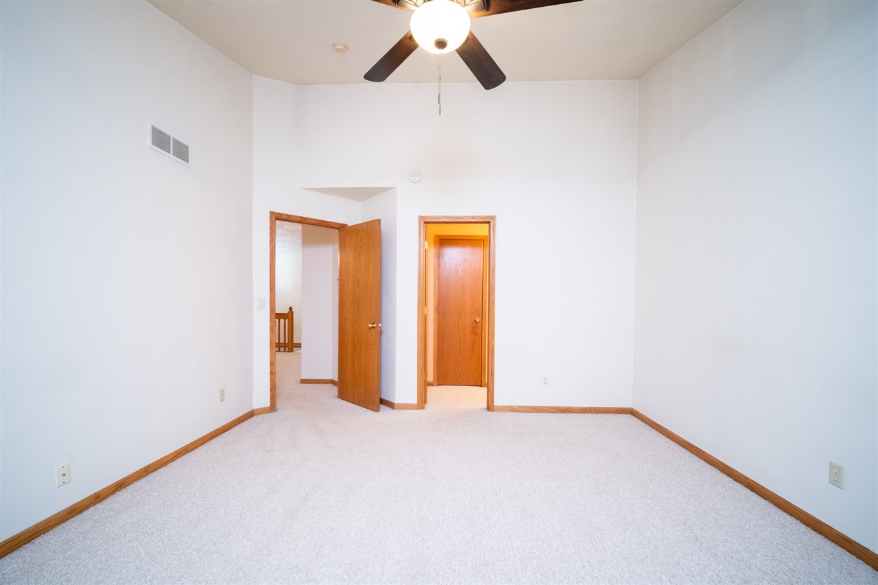 6614 North Point Road Rockford, IL 61108 - Photo 12 of 26 a view of an empty room with a window