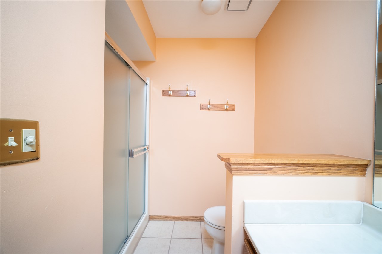 6614 North Point Road Rockford, IL 61108 - Photo 13 of 26 a bathroom with a toilet and a shower