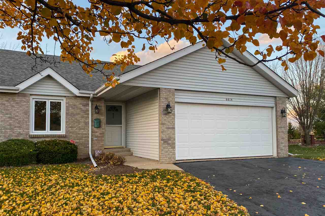 6614 North Point Road Rockford, IL 61108 - Photo 2 of 26 a front view of a house with a garden