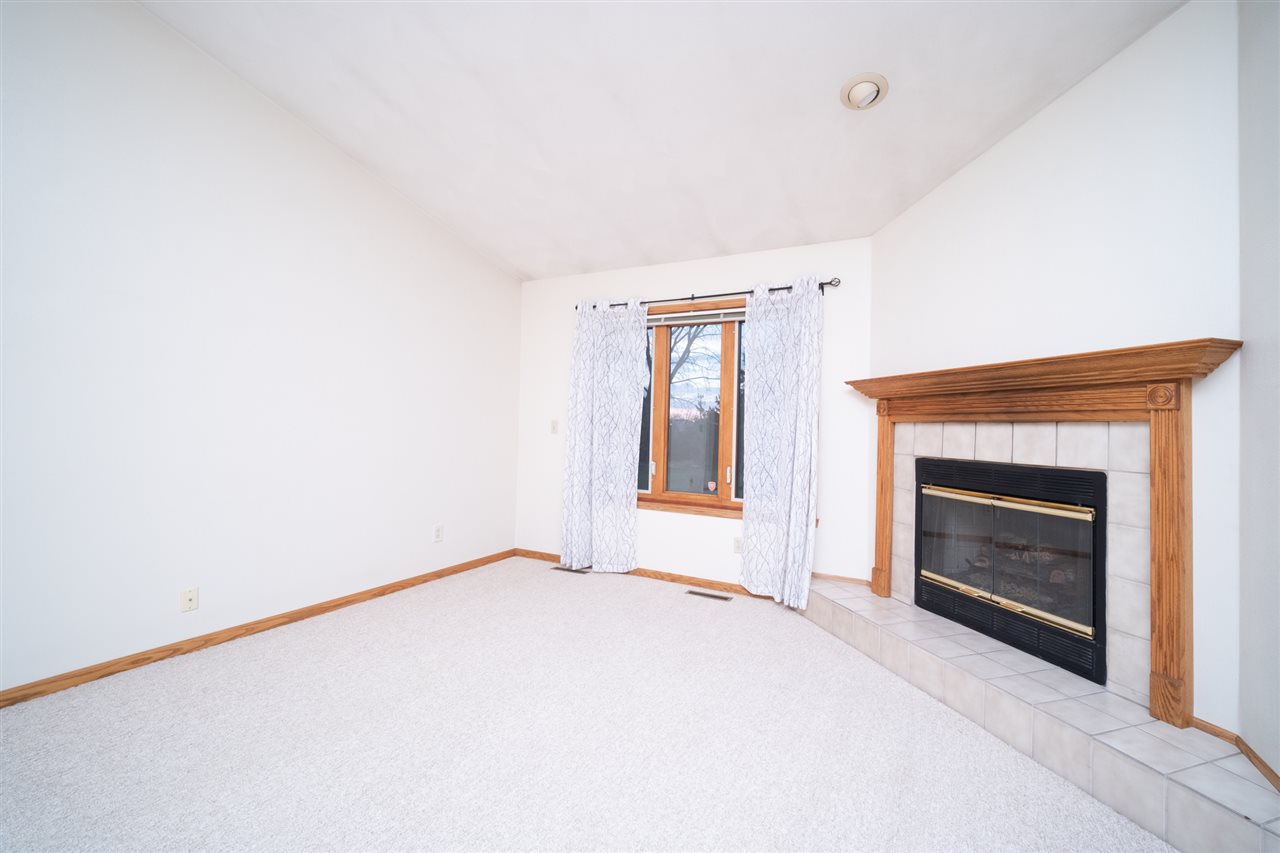 6614 North Point Road Rockford, IL 61108 - Photo 6 of 26 a view of empty room with a fireplace