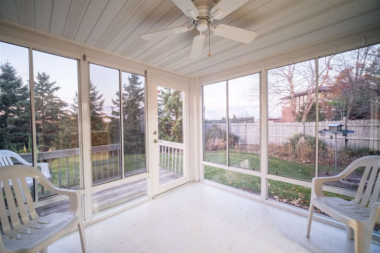 6614 North Point Road Rockford, IL 61108 - Photo 10 of 26 a view of porch with a floor to ceiling window and wooden floor