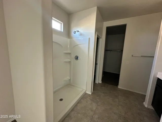 a view of a bathroom from a hallway