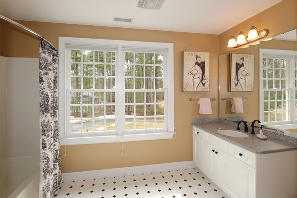 112 Newbridge Road Sudbury, MA 01776 - Photo 23 of 30 a bathroom with a sink mirror and a window