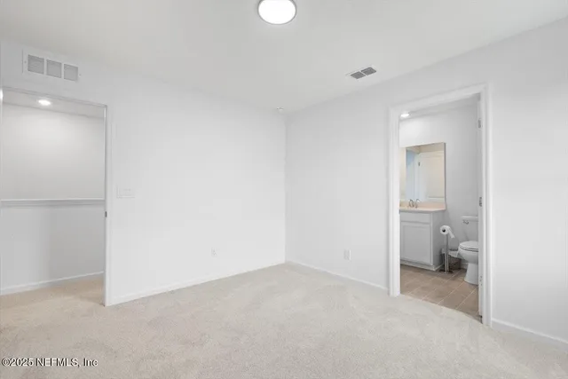 a view of a room that has a bathroom