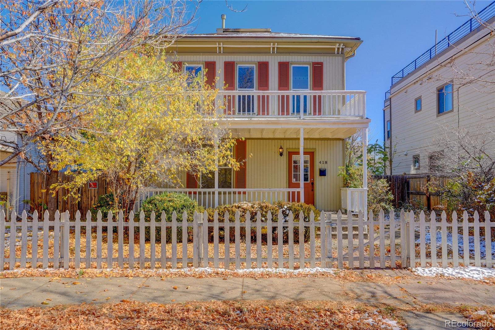 418 Inca Street Denver, CO 80204 - Photo 1 of 24 a front view of a house with glass windows