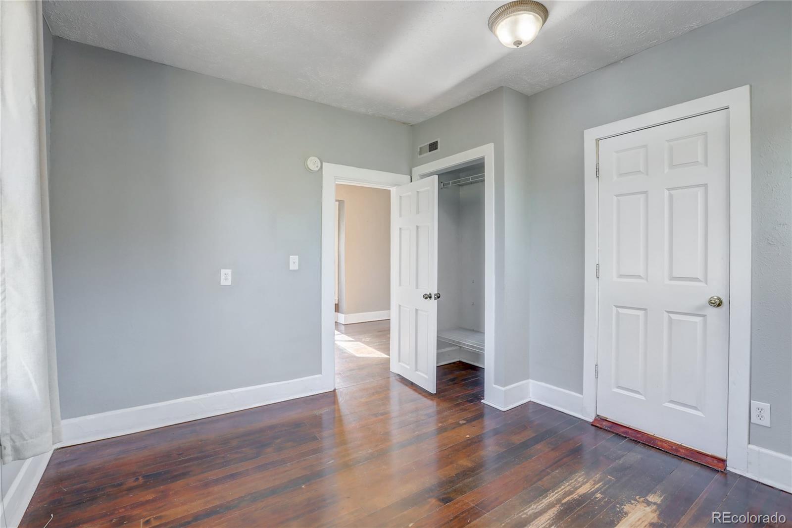418 Inca Street Denver, CO 80204 - Photo 21 of 24 a view of empty room with wooden floor