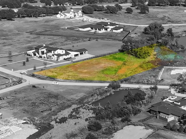 a view of a swimming pool with a yard