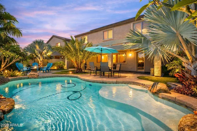 a view of swimming pool with outdoor seating