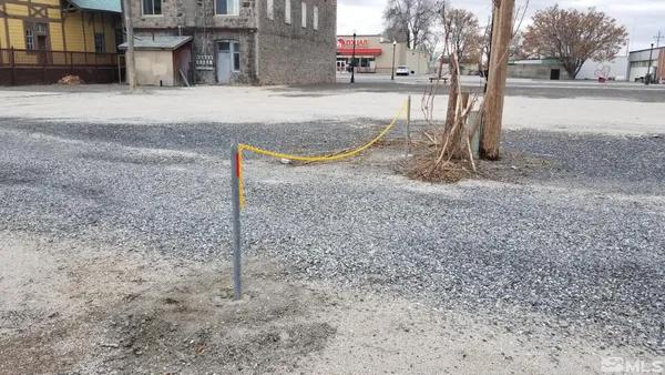 a view of a street with a yard