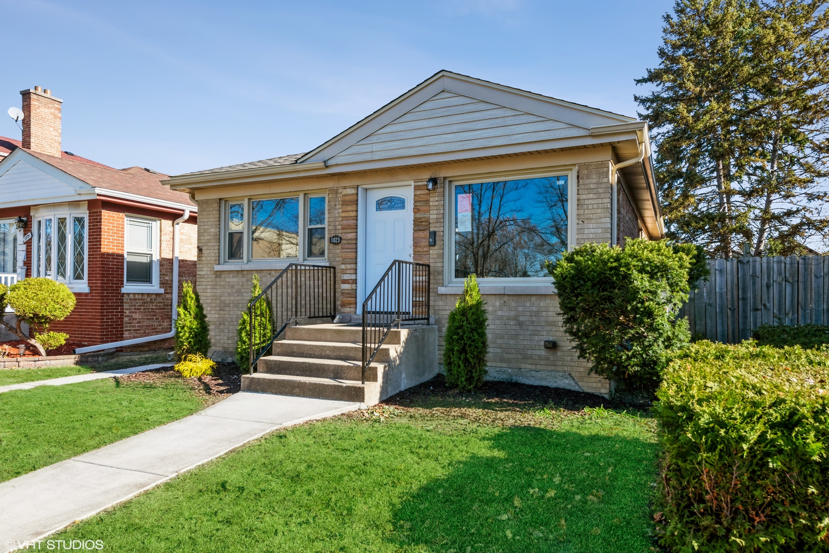 1023 Rice Avenue Bellwood, IL 60104 - Photo 2 of 12 a front view of a house with garden