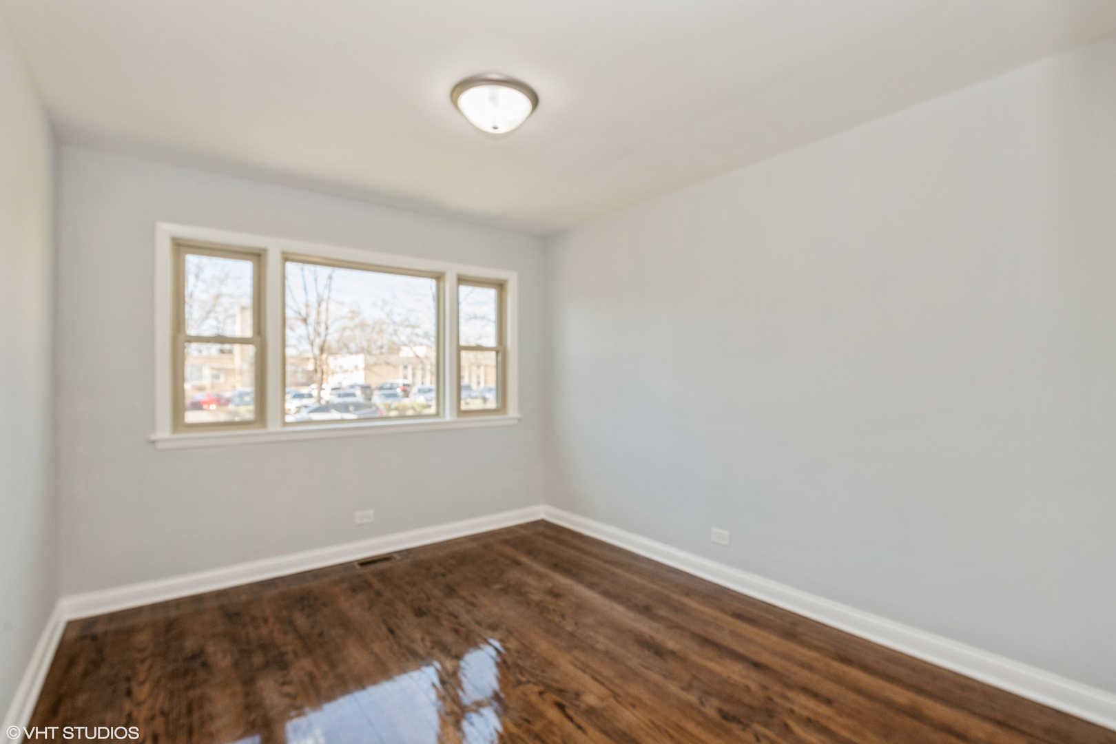 1023 Rice Avenue Bellwood, IL 60104 - Photo 5 of 12 a view of a room with wooden floor and window