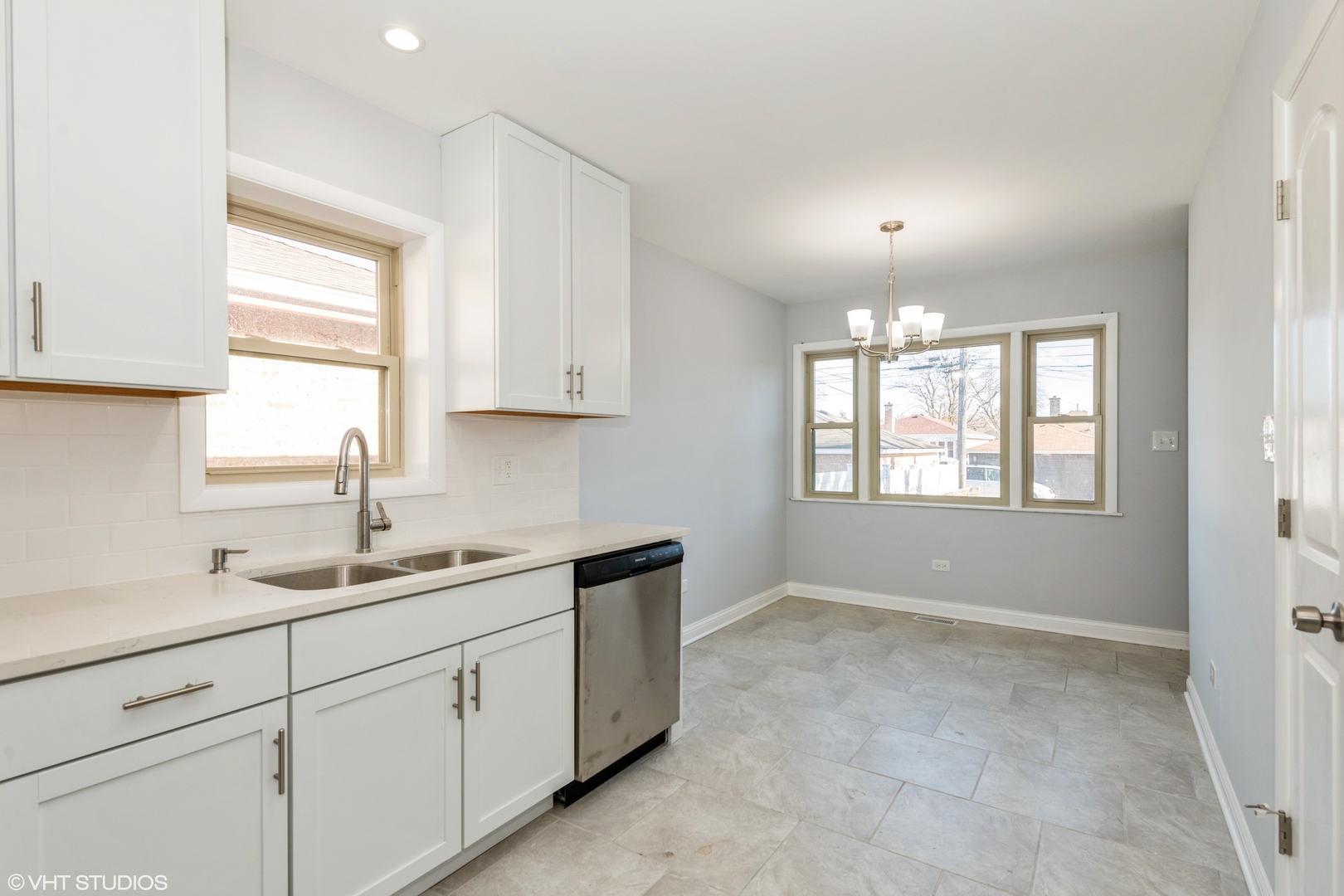 1023 Rice Avenue Bellwood, IL 60104 - Photo 8 of 12 a kitchen with a sink cabinets and window