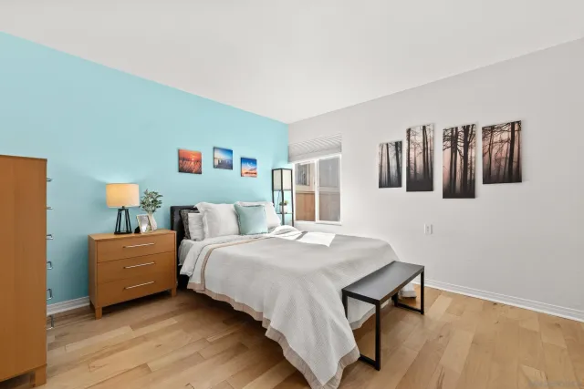 a bedroom with a bed and a table in it