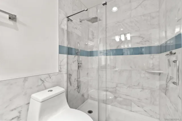 a bathroom with a toilet and shower