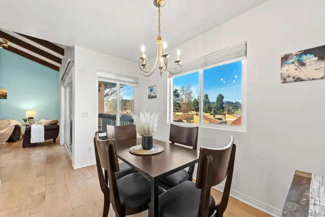 a view of a dining room with furniture window and outside view
