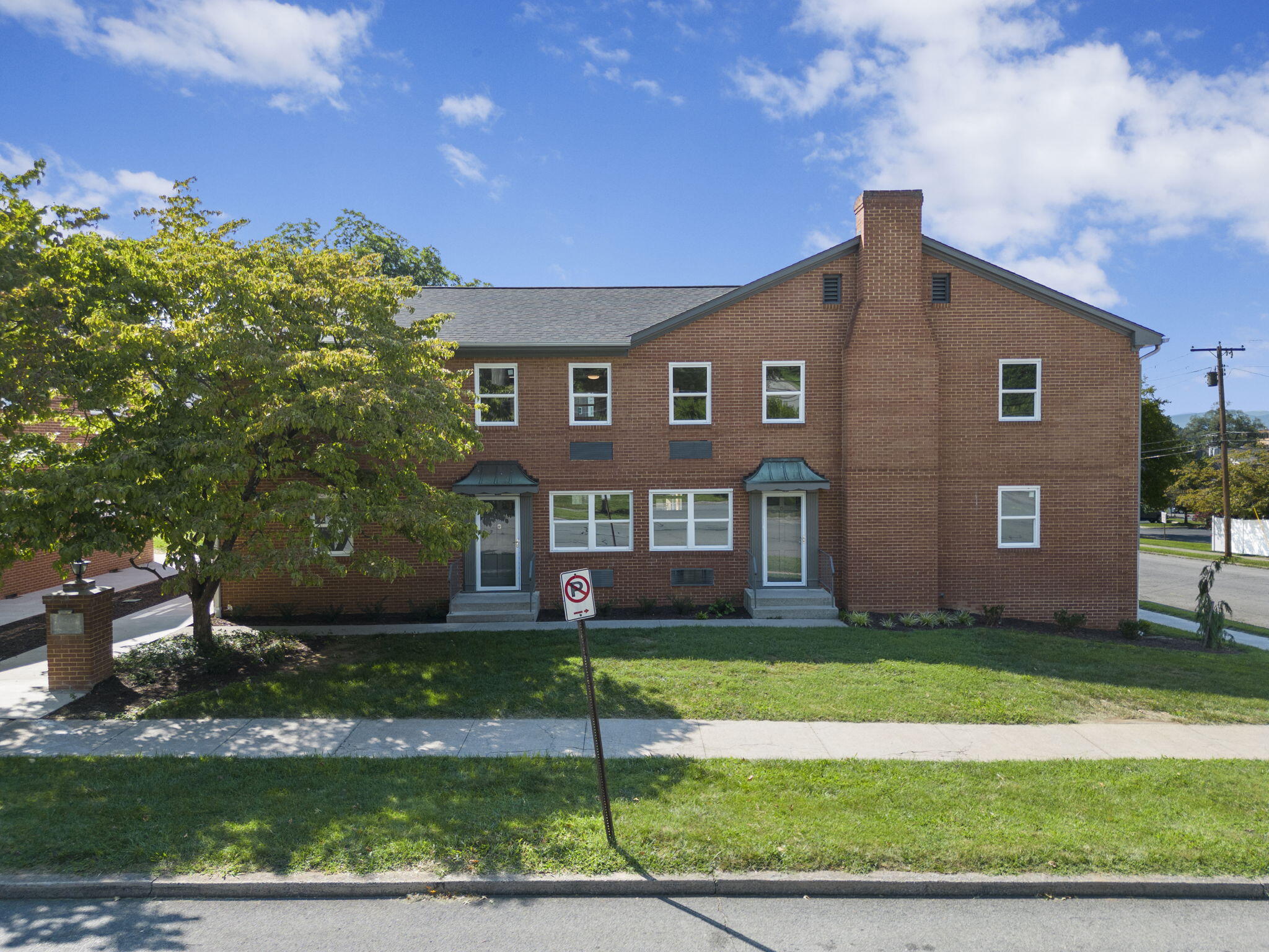 2209 Jefferson Street Southwest, Unit B Roanoke, VA 24014 - Photo 1 of 12 a front view of a house with a garden