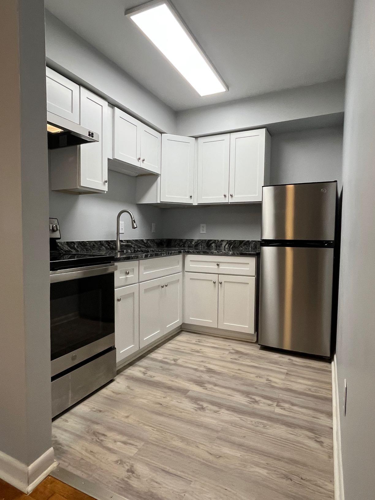 2209 Jefferson Street Southwest, Unit B Roanoke, VA 24014 - Photo 8 of 12 a kitchen with a sink stove and refrigerator