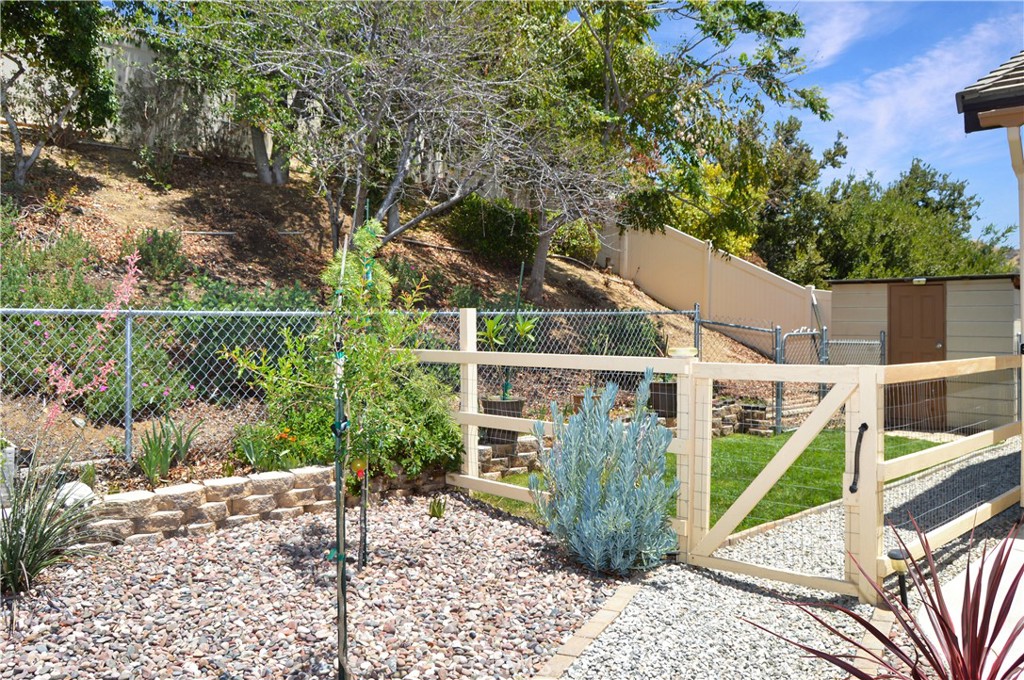 166 Fox Lane Calimesa, CA 92320 - Photo 69 of 76 Separate, Gated Dog Run with Shed. Two More Sheds are Around the Corner of the House in Another Gated Area Your Furry Friends Can Explore (not visible here).