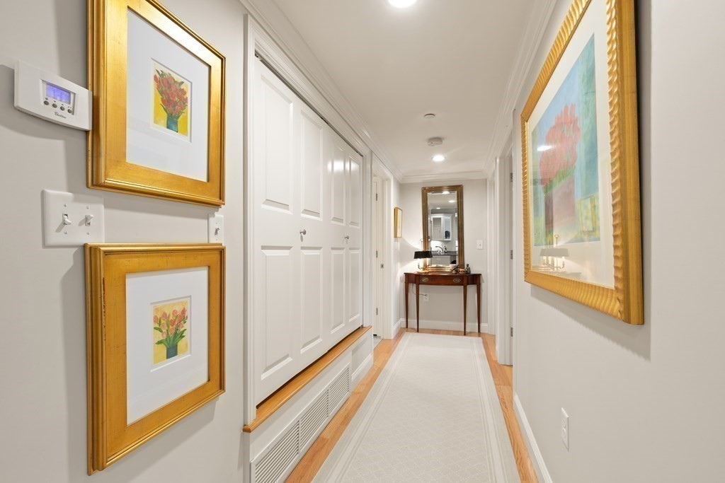 2 Manor Terrace, Unit 209 Lexington, MA 02420 - Photo 15 of 26 a view of a hallway with wooden floor and a large window