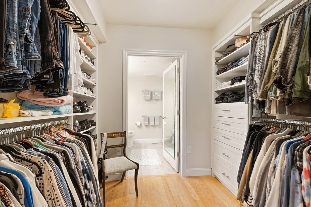 2 Manor Terrace, Unit 209 Lexington, MA 02420 - Photo 19 of 26 a view of walk in closet with clothes and shoes