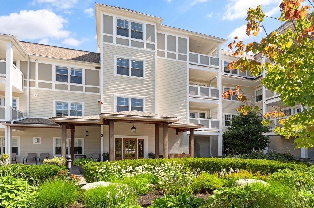 2 Manor Terrace, Unit 209 Lexington, MA 02420 - Photo 2 of 26 a front view of a multi story building