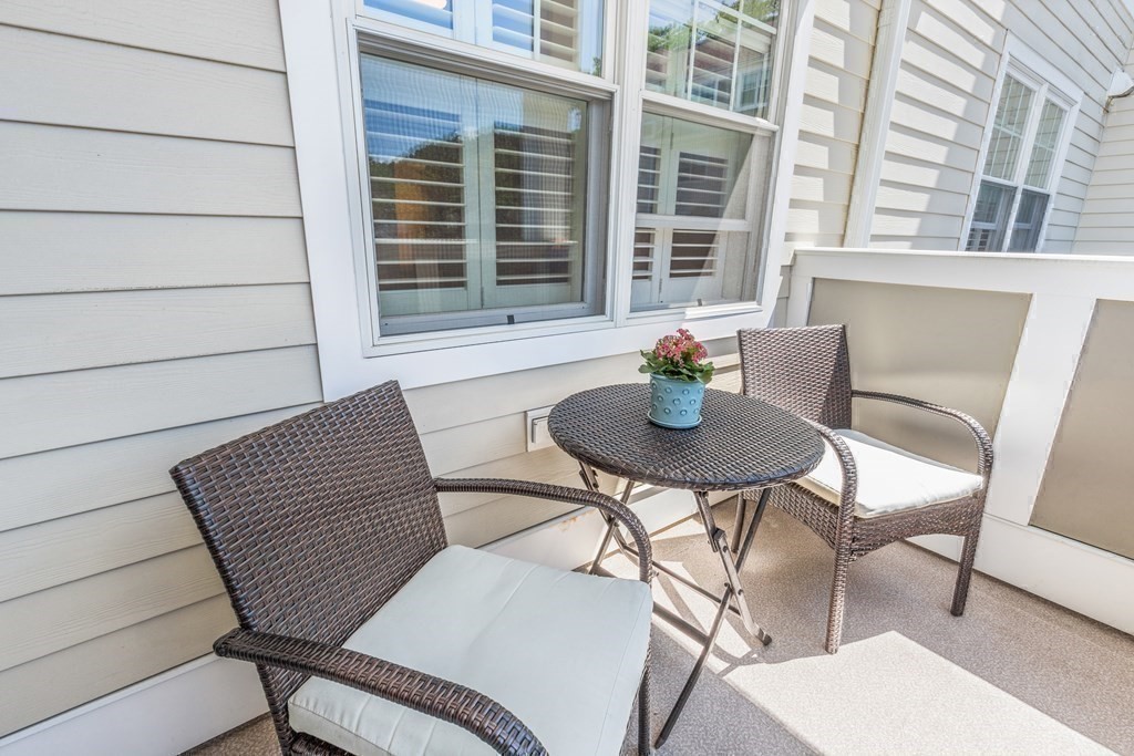 2 Manor Terrace, Unit 209 Lexington, MA 02420 - Photo 23 of 26 a view of a outdoor seating area with furniture