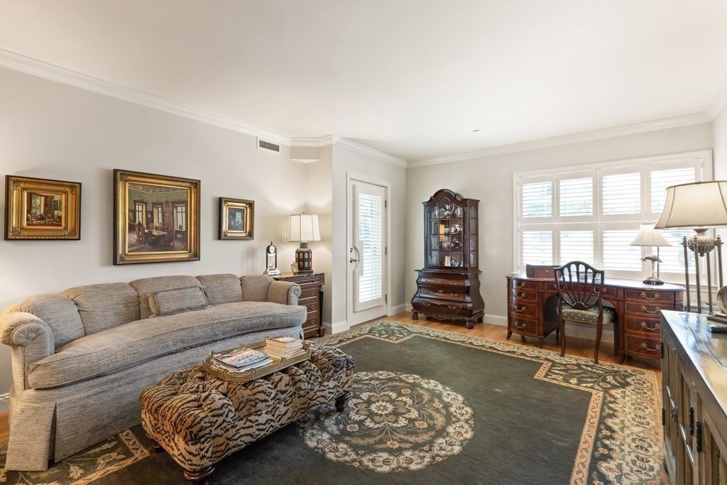 2 Manor Terrace, Unit 209 Lexington, MA 02420 - Photo 5 of 26 a living room with furniture and a rug