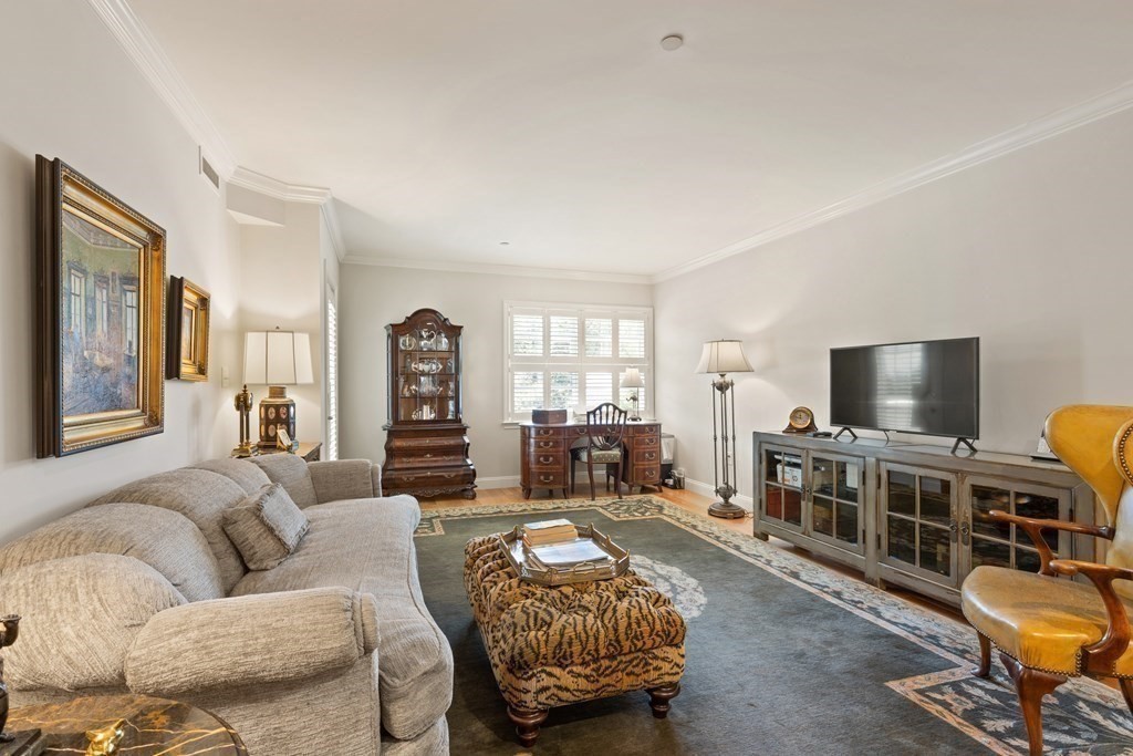 2 Manor Terrace, Unit 209 Lexington, MA 02420 - Photo 6 of 26 a living room with furniture and a flat screen tv