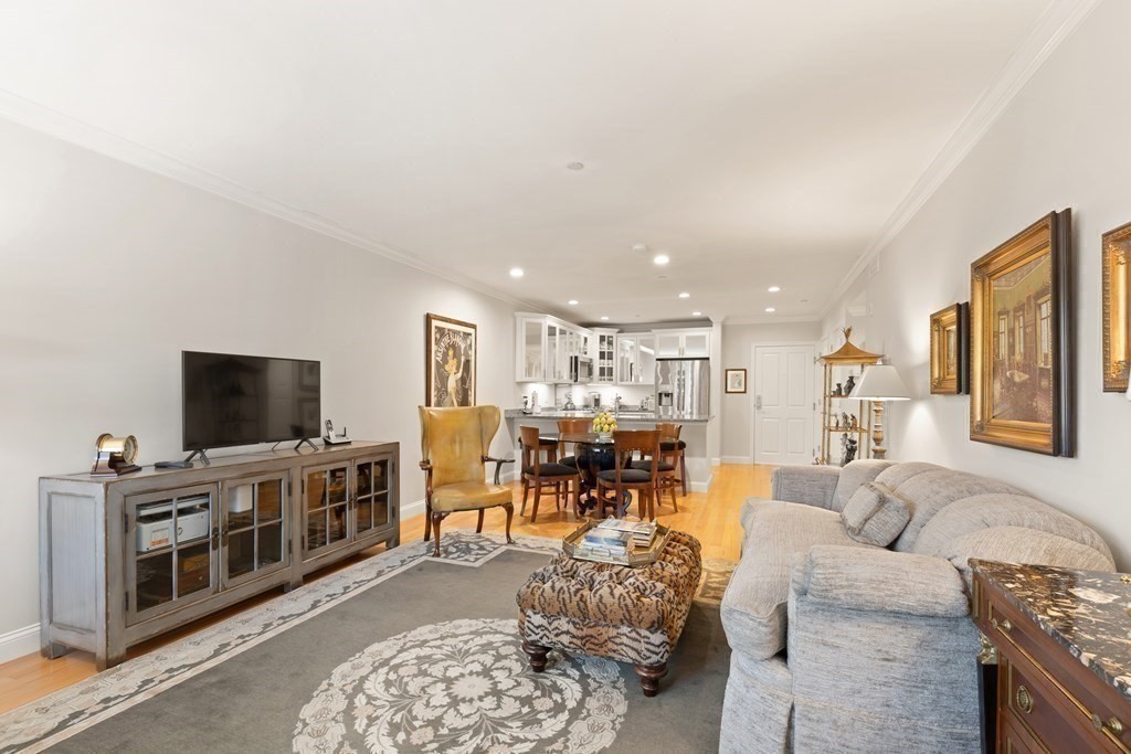 2 Manor Terrace, Unit 209 Lexington, MA 02420 - Photo 7 of 26 a living room with furniture and a flat screen tv