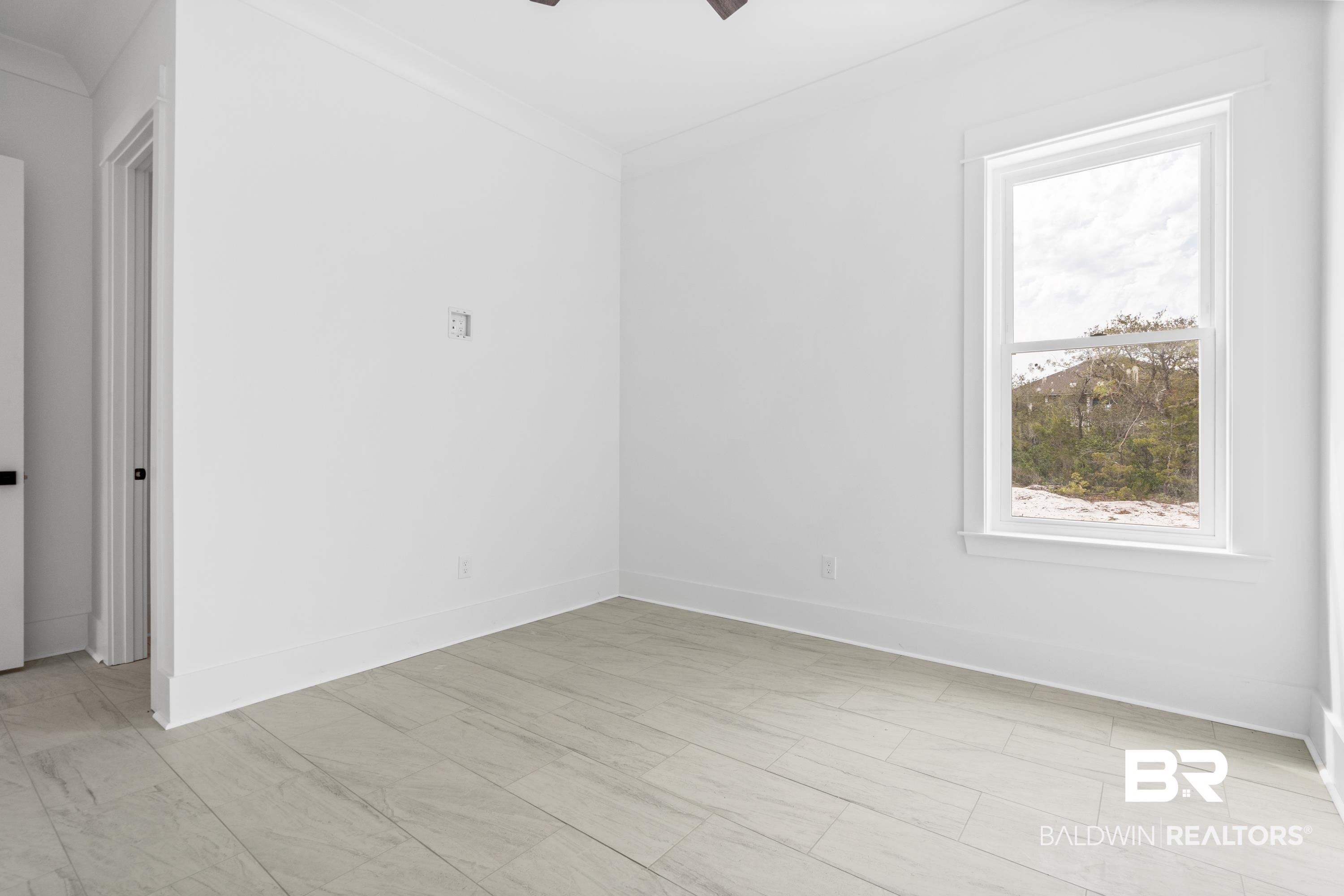 30650 Ono N Loop West Orange Beach, AL 36561 - Photo 30 of 38 Unfurnished room with a ceiling fan and baseboards