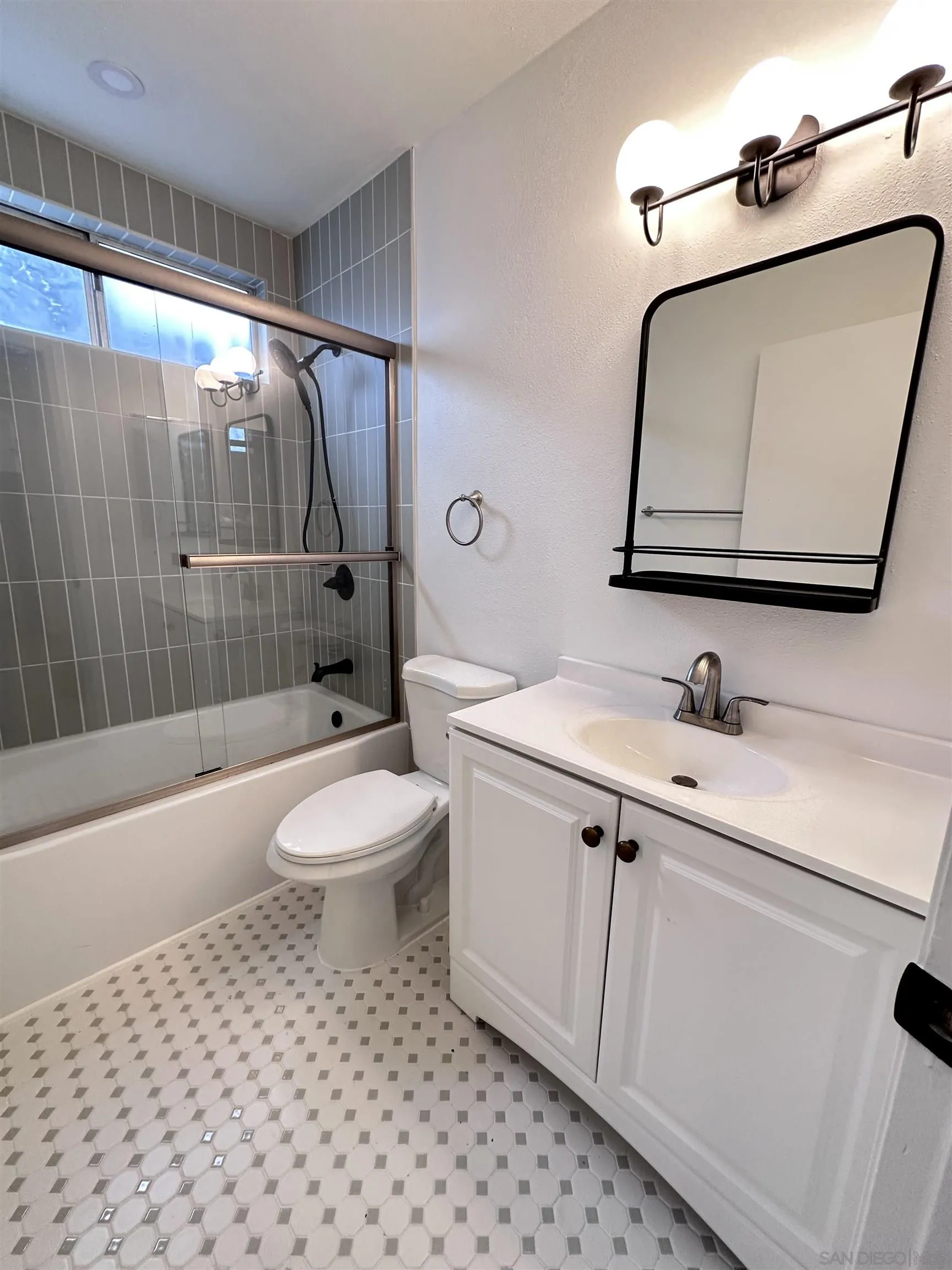 930 B B Avenue, Unit 22 National City, CA 91950 - Photo 13 of 14 a bathroom with a toilet a sink and mirror