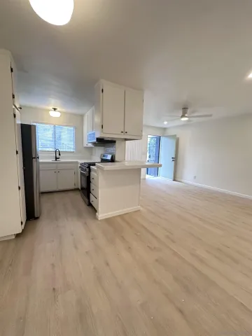 a view of a kitchen with a sink