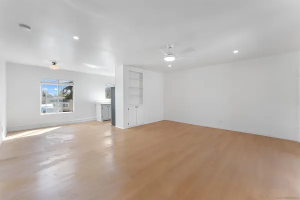 a view of empty room with a fireplace