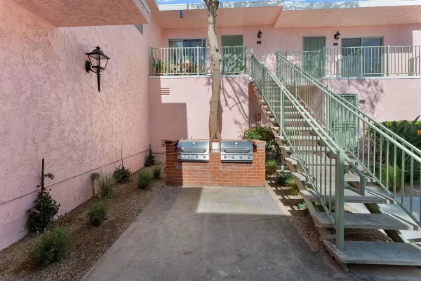 a view of a balcony with yard