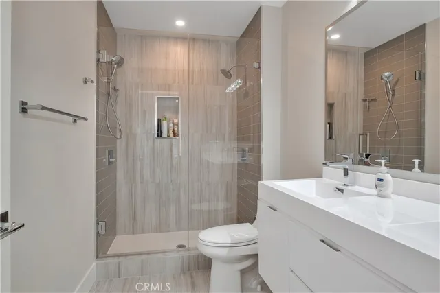 a bathroom with a sink toilet and shower