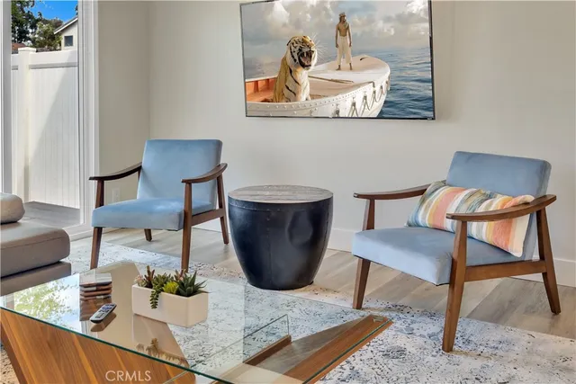 a view of a dining room with furniture and a rug