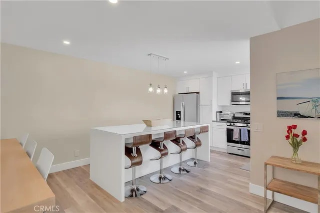 a living room with fireplace furniture and a wooden floor