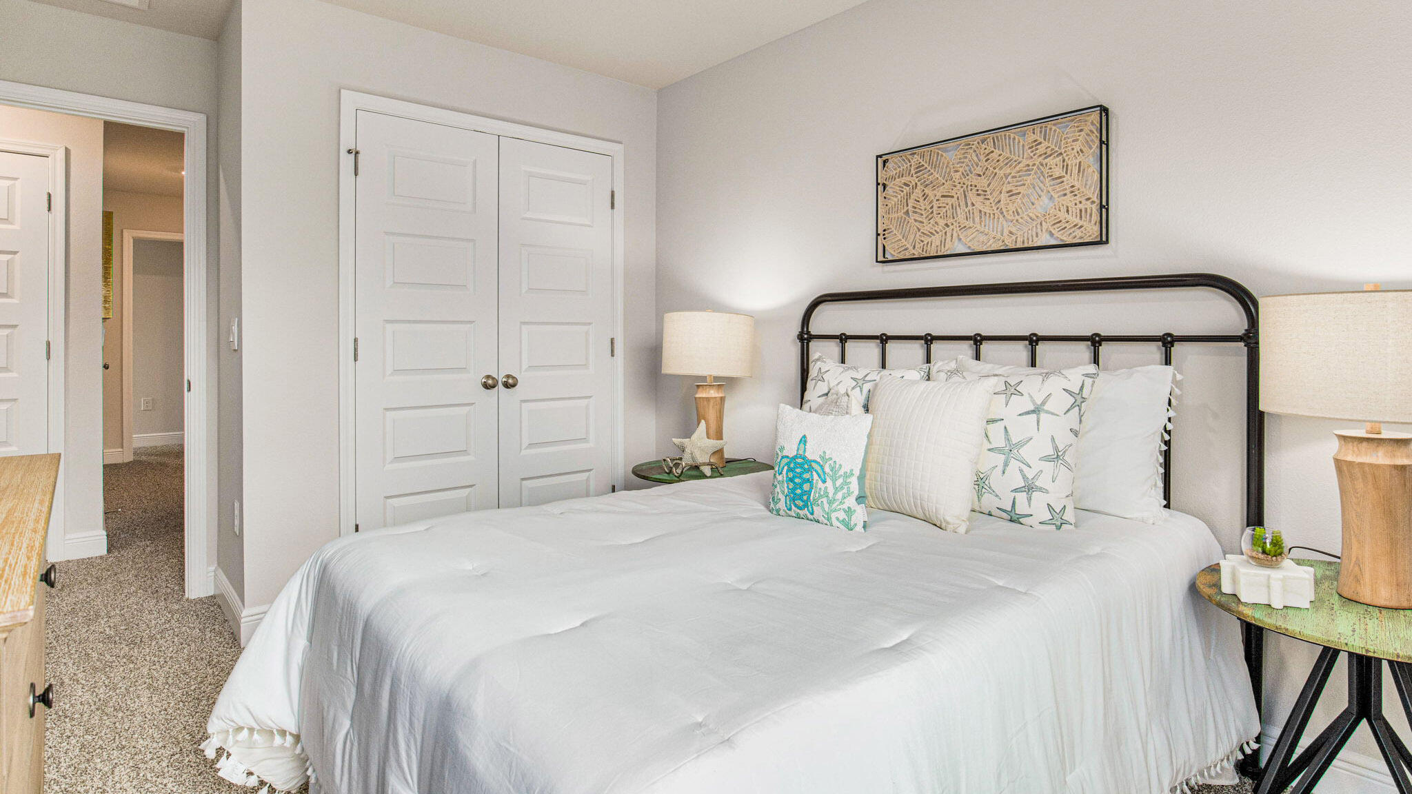 8553 Midtown Court Navarre, FL 32566 - Photo 21 of 27 a bedroom with a bed and a view of bathroom