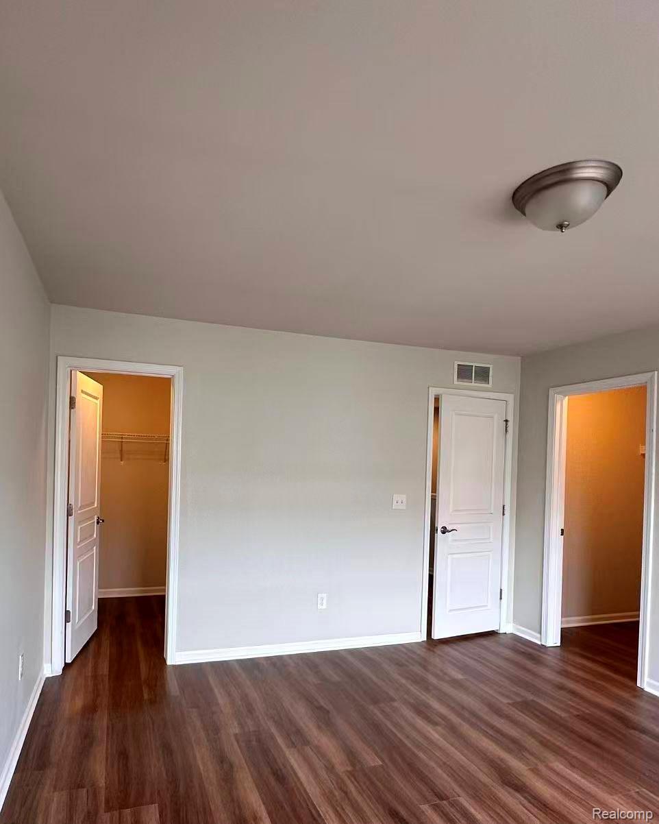 2578 Helmsdale Circle Rochester, MI 48307 - Photo 19 of 33 Wood-finish flooring throughout, complemented by light gray wall tones and white trim